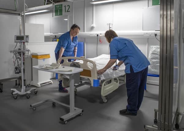 Nurses make final preparations during the completion of the construction of the NHS Louisa Jordan hospital