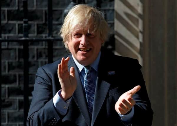 Prime Minister Boris Johnson claps to mark the 72nd anniversary of the NHS  on 5 July 2020 (Picture: Getty Images)