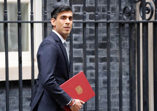 Chancellor Rishi Sunak leaves 11 Downing Street on his way to deliver a mini-budget statement in the Commons (Picture: Tolga Akmen/AFP via Getty Images)