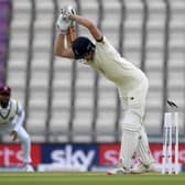 The bails fly after England opener Dom Sibley misjudged a delivery by Shannon Gabriel. Picture: Mike Hewitt/Pool via AP