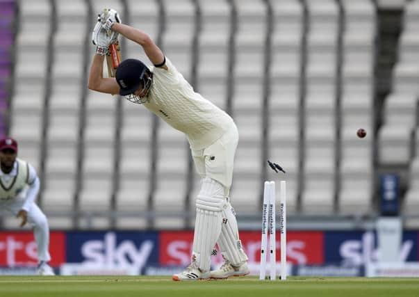 The bails fly after England opener Dom Sibley misjudged a delivery by Shannon Gabriel. Picture: Mike Hewitt/Pool via AP