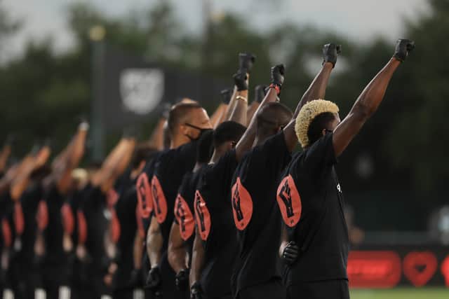 Players take part in a Black Lives Matter ceremony before the MLS match between Orlando City and Inter Miami  in Reunion, Florida. Picture: Mike Ehrmann/Getty Images