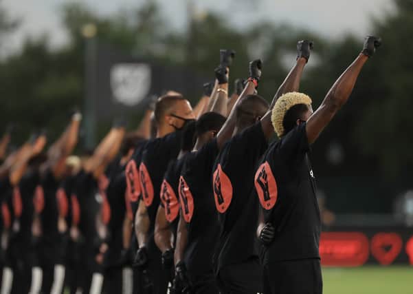 Players take part in a Black Lives Matter ceremony before the MLS match between Orlando City and Inter Miami  in Reunion, Florida. Picture: Mike Ehrmann/Getty Images