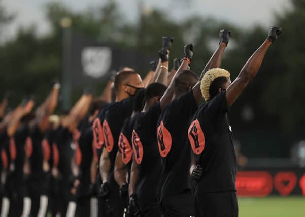 Players take part in a Black Lives Matter ceremony before the MLS match between Orlando City and Inter Miami in Reunion, Florida. Picture: Mike Ehrmann/Getty Images