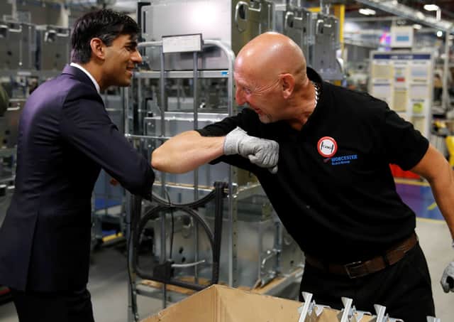 Chancellor Rishi Sunak greets an employee during a visit to the Bosch factory in Worceste (Picture: Phil Noble/pool/AFP via Getty Images)