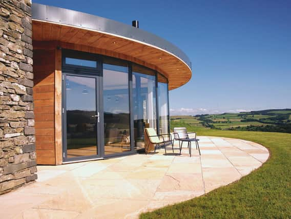 Rink Hill is a light-filled architectural masterpiece, built with recycled stone from the farmwith and with bespoke floor-to-ceiling glass windows that make the most of the stunning views.