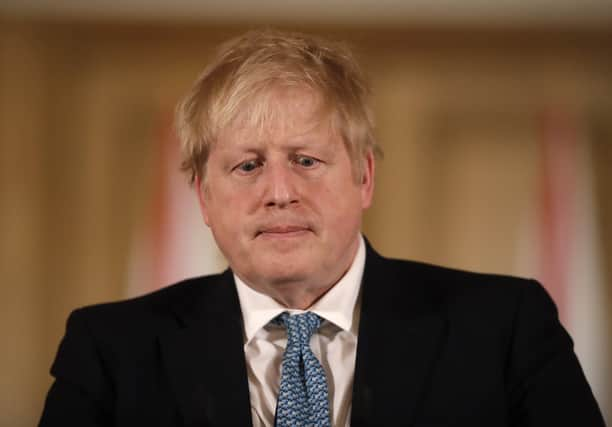 LONDON, ENGLAND - MARCH 17: British Prime Minister Boris Johnson gives a press conference about the ongoing situation with the coronavirus (COVID-19) outbreak inside 10 Downing Street on March 17, 2020 in London, England. For most people, the new coronavirus causes only mild or moderate symptoms, such as fever and cough. For some, especially older adults and people with existing health problems, it can cause more severe illness, including pneumonia. (Photo by Matt Dunham - WPA Pool/Getty Images)