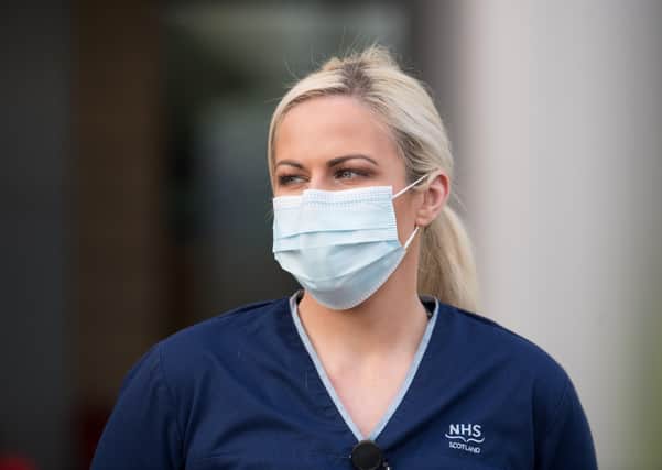 Masks are not a guarantee against infection and some fear they could provide false reassurance, encouraging people to engage in more risky behaviour (Picture: John Devlin)