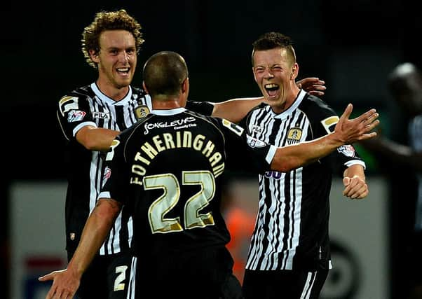 Callum McGregor celebrates scoring for Notts County in a  Capital One Cup match in 2013