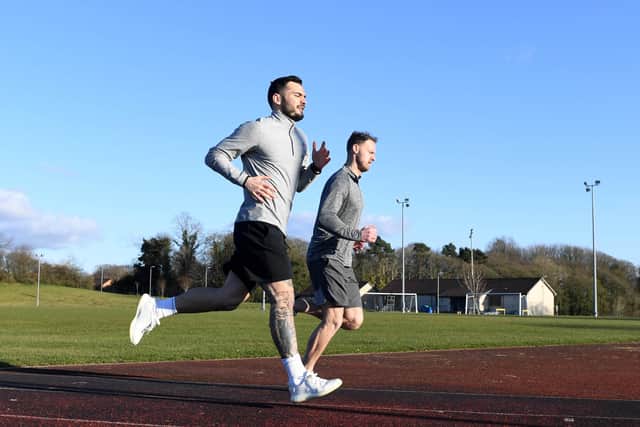 Motherwell striker Tony Watt and goalkeeper Trevor Carson pictured training at Dalziel Park in March after Scottish football was suspended due to the cornonavirus pandemic. Picture: Craig Williamson/SNS Group