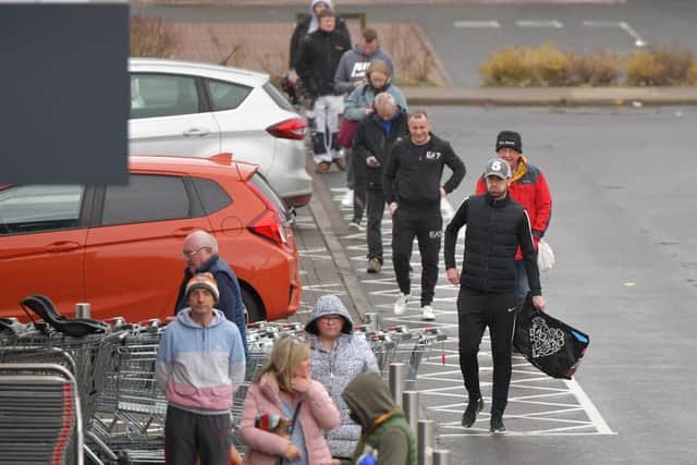 Customers at Aldi in Camelon observe social distancing in the queue, but is two metres the right distance, asks Stephen Jardine.