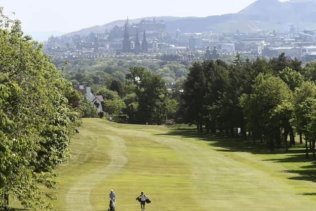 Golfers walk down a fairway at Murrayfield Golf Club in Edinburgh as the sport resumed in Scotland. Picture: Lisa Ferguson
