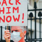 A protester holds a placard demanding the sacking of the Prime Minister's aide. Picture: Tolga Akmen/Getty