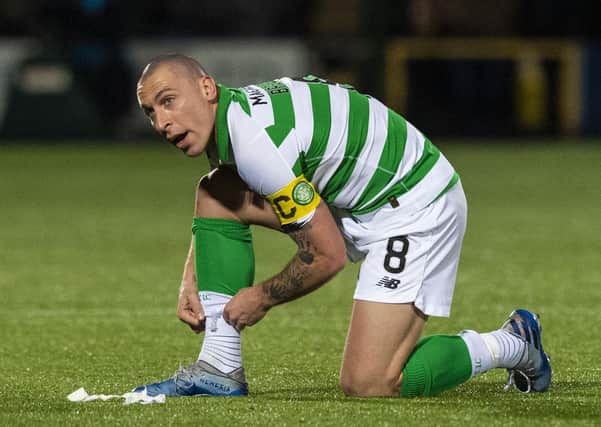 Celtic captain Scott Brown has been watching the return to action in Germany on TV and found it odd hearing players' voices echoing in empty stadiums. Picture: SNS.
