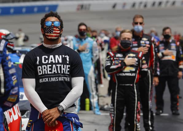 Nascar Cup driver Bubba Wallace wears  a "I Can't Breath - Black Lives Matter" T-shirt under his fire suit in solidarity with protesters around the world taking to the streets after the death of George Floyd (Picture: Chris Graythen/Getty Images)