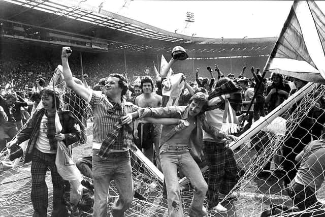 The crossbar comes a cropper as Scotland fans celebrate a famous win over England at Wembley in 1977. Picture: Denis Straughan/The Scotsman