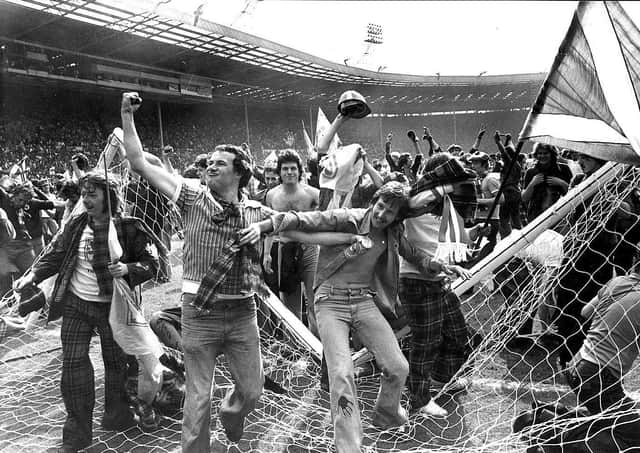 The crossbar comes a cropper as Scotland fans celebrate a famous win over England at Wembley in 1977. Picture: Denis Straughan/The Scotsman