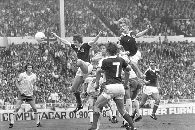 Gordon McQueen scores in Scotland's victory against England at Wembley in 1977.
 Picture: Denis Straughan/The Scotsman