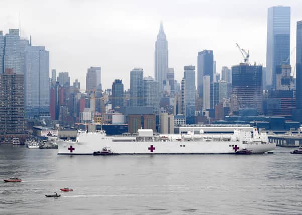 A US Navy Hospital Ship travels up the Hudson River to Manhattan in March to provide beds for non-Covid patients (Picture: Dimitrios Kambouris/Getty Images)