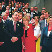 Alex Salmond then SNP leader and his deputy Nicola Sturgeon stands with SNP's 47 newly elected MSP's after taking their oath in a swearing in ceremony at the Scottish Parliament May 9, 2007. Picture: Getty