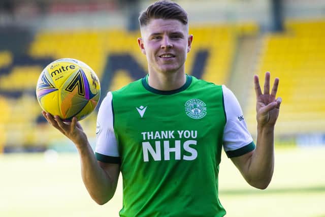 Hibs striker Kevin Nisbet takes the match ball home following his hat-trick against Livingston. Picture: Ross MacDonald/SNS Group