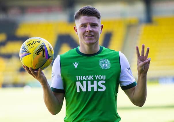 Hibs striker Kevin Nisbet takes the match ball home following his hat-trick against Livingston. Picture: Ross MacDonald/SNS Group