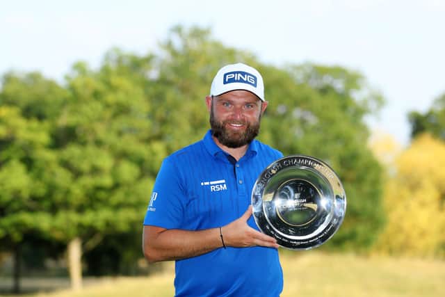 The smile on Andy Sullivan’s face says it all as he shows off the English Championship silverware after his seven-shot success at Hanbury Manor in Hertfordshire. Picture: Getty