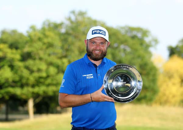 The smile on Andy Sullivan’s face says it all as he shows off the English Championship silverware after his seven-shot success at Hanbury Manor in Hertfordshire. Picture: Getty