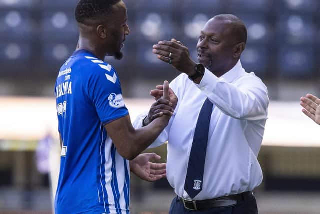 Manager Alex Dyer congratulates Nicke Kabamba following his display against Celtic on Sunday. Picture: SNS