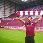 Jordan Roberts shows off his new colours  at Tynecastle after signing for Hearts.