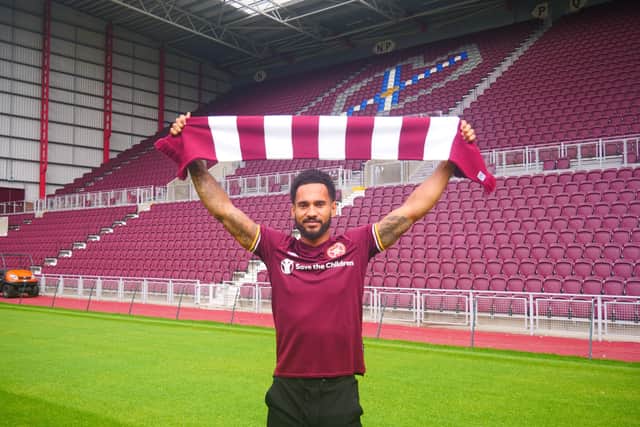Jordan Roberts shows off his new colours at Tynecastle after signing for Hearts.
