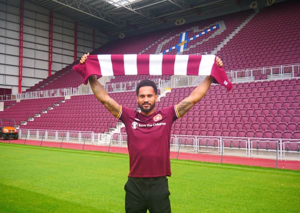 Jordan Roberts shows off his new colours  at Tynecastle after signing for Hearts.