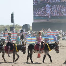 A united kingdom? Andy Murray fans relax on Skegness beach watching him take part in the men's Wimbledon final in 2013 (Picture: SWNS)