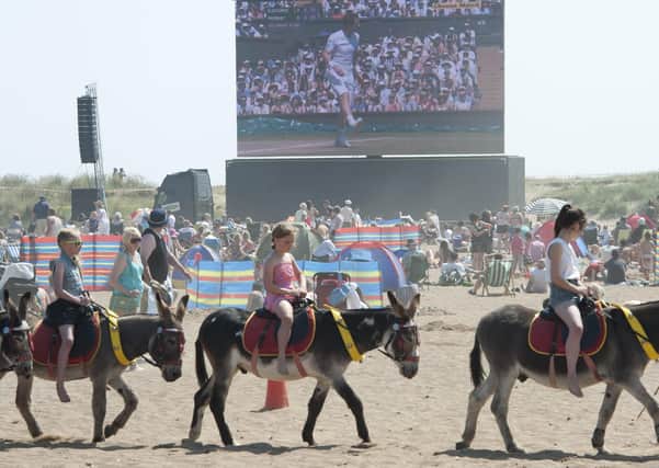 A united kingdom? Andy Murray fans relax on Skegness beach watching him take part in the men's Wimbledon final in 2013 (Picture: SWNS)
