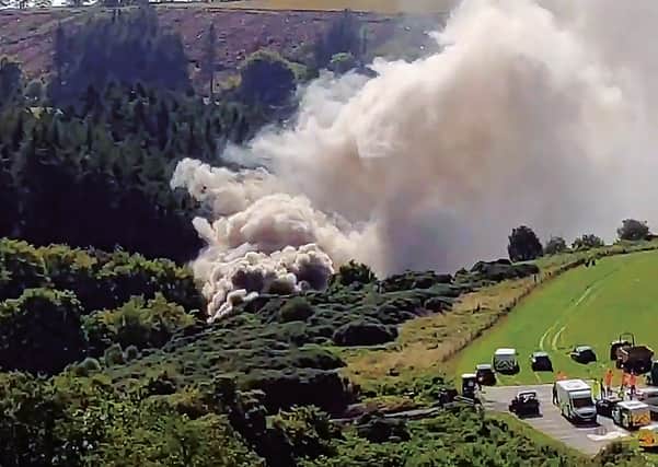 A still image taken from video footage shows smoke billowing from the scene of a train crash near Stonehaven . Picture: Chris Harvey