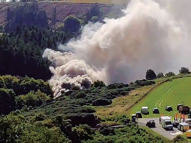 A still image taken from video footage shows smoke billowing from the scene of a train crash near Stonehaven . Picture: Chris Harvey