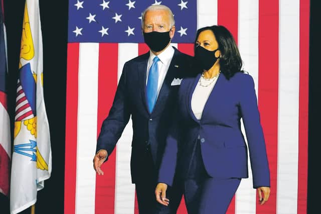 Democratic presidential candidate former vice-president Joe Biden and his running mate Senator Kamala Harris arrive to speak at a news conference at Alexis Dupont High School in Wilmington. Picture: AP Photo/Carolyn Kaster