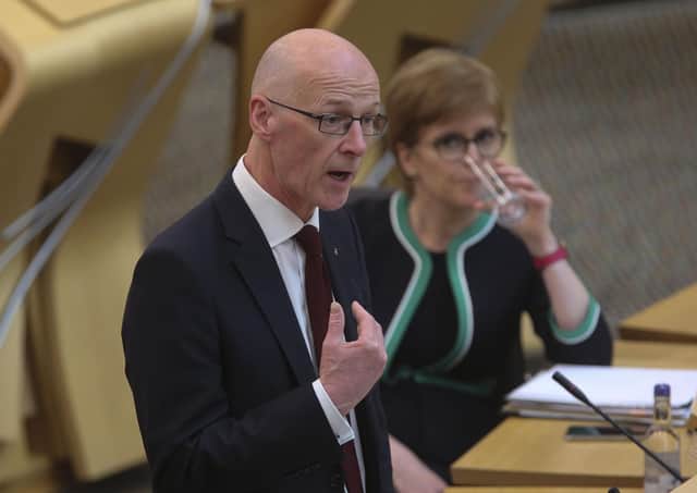 Scottish First Minister Nicola Sturgeon looks on as Deputy First Minister and Cabinet Secretary for Education and Skills John Swinney speaks on SQA exam results. Picture: Fraser Bremner - Pool/Getty Images