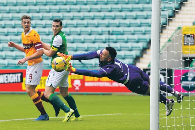 Ofir Marciano’s made a great save from Callum Lang to keep Hibs level. Photograph: Ross MacDonald/SNS