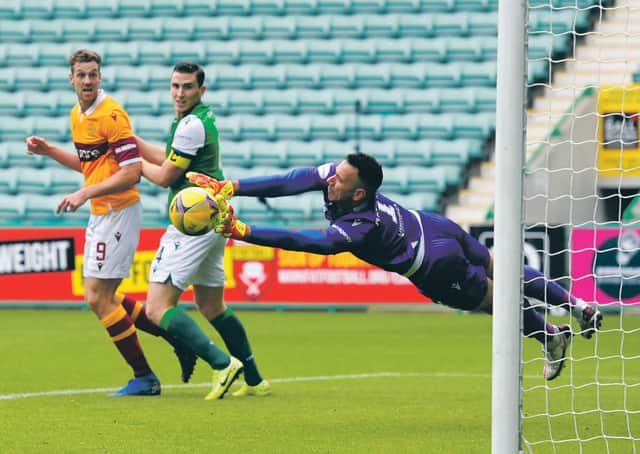 Ofir Marciano’s made a great save from Callum Lang to keep Hibs level. Photograph: Ross MacDonald/SNS