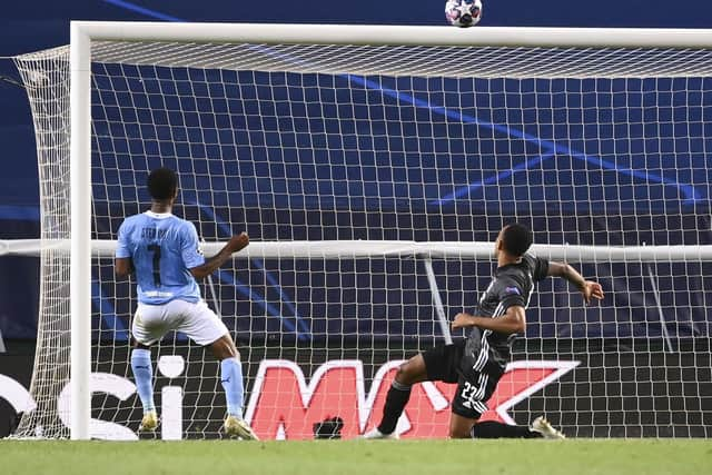 Manchester City's Raheem Sterling, left, puts the ball over the bar with the goal gaping. Picture: Franck Fife/AP