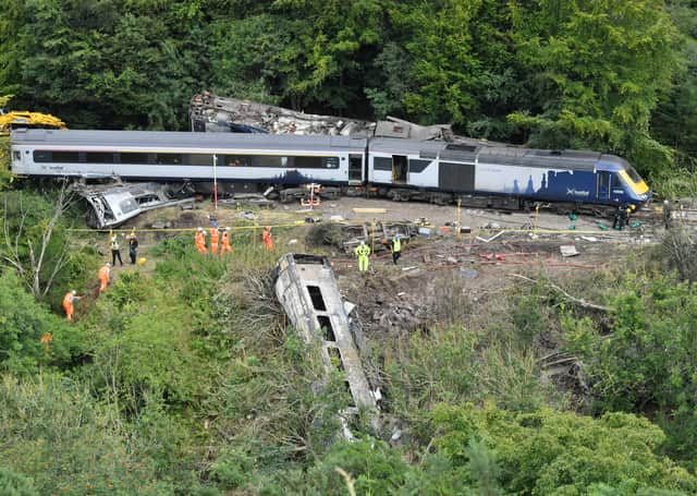 Emergency services inspect the scene following the derailment of the ScotRail train which cost the lives of three people. Picture: Ben Birchall WPA Pool/Getty Images