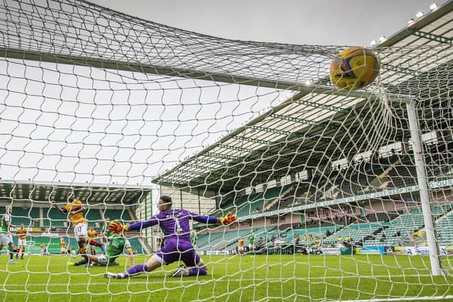 Jordan White’s shot deflects off Paul Hanlon before finding the Hibs’ net, but Motherwell were denied the goal which was ruled out due to Sherwin Seedorf being offside. Picture: Scottish Sun/Pool/via SNS.
