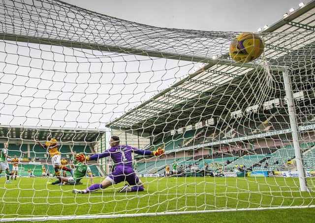 Jordan White’s shot deflects off Paul Hanlon before finding the Hibs’ net, but Motherwell were denied the goal which was ruled out due to Sherwin Seedorf being offside. Picture: Scottish Sun/Pool/via SNS.