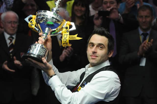 Ronnie O'Sullivan with the world championship trophy. Picture: BBC