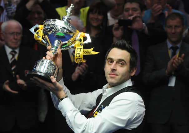 Ronnie O'Sullivan with the world championship trophy. Picture: BBC