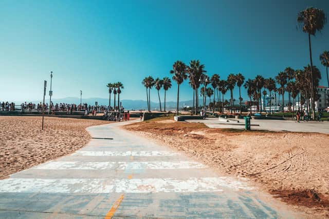 Cycle paths and sunshine make staying on the coast and hiring bikes to get around a good option in a city with little public transport.