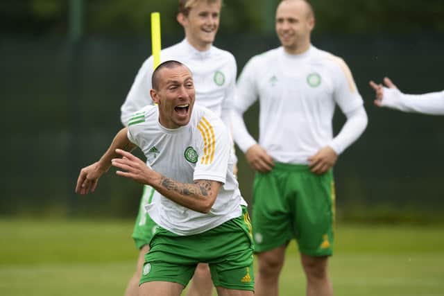 Scott Brown enjoys training at Lennoxtown ahead of the Champions League qualifying tie at Celtic Park. Picture: Craig Foy/SNS