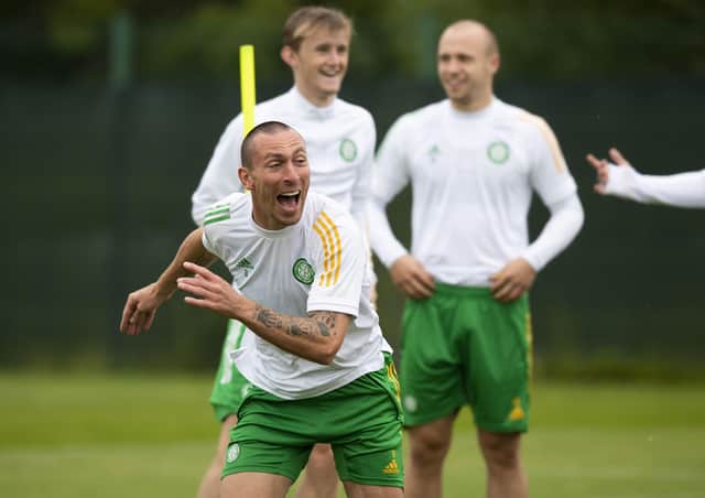Scott Brown enjoys training at Lennoxtown ahead of the Champions League qualifying tie at Celtic Park. Picture: Craig Foy/SNS