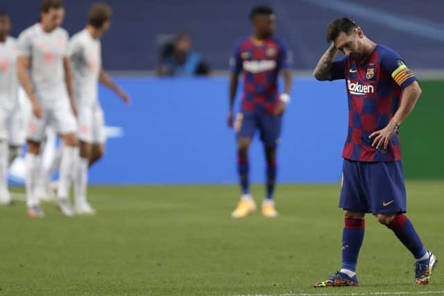 Lionel Messi hangs his head in anguish during Barcelona’s 8-2 destruction by Bayern Munich. Picture: AP.